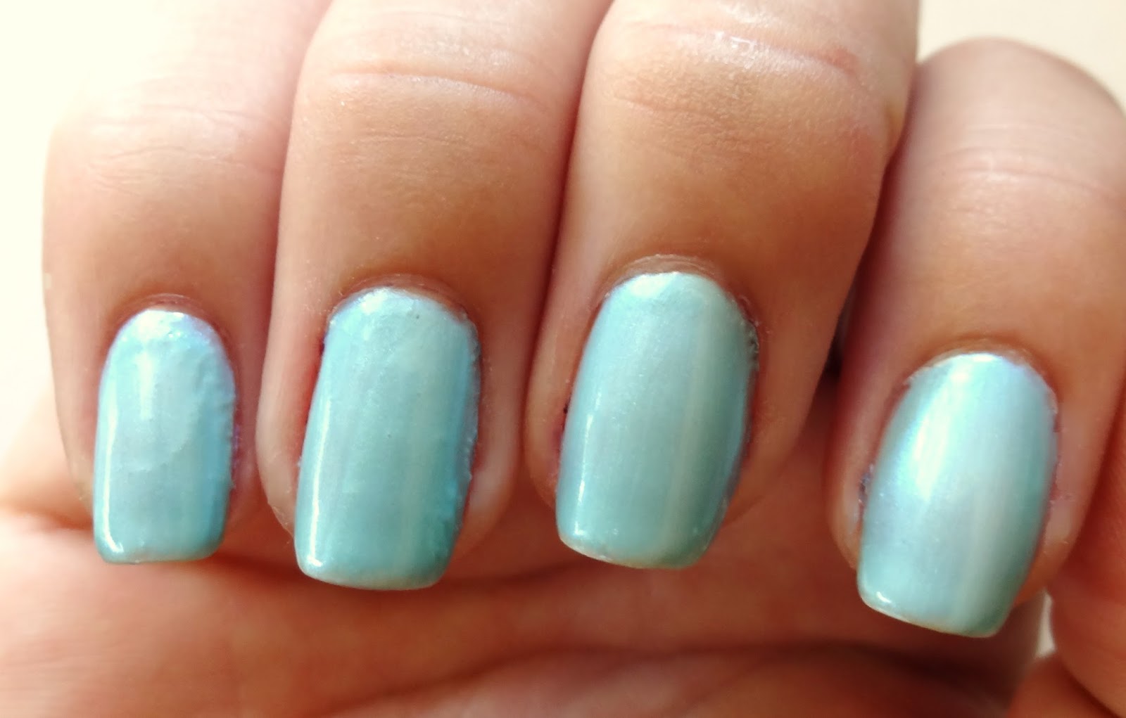 Blue base color nails.