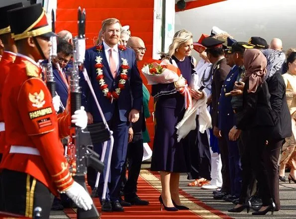 Queen Maxima wore Oscar De La Renta Cold-shoulder ruffled wool midi dress. President Joko Widodo, Kalimantan and Sumatra
