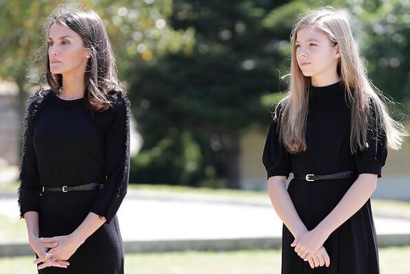 King Felipe, Queen Letizia, Princess Leonor and Infanta Sofia observed a minute's silence for victims of the coronavirus. Felipe Varela dress
