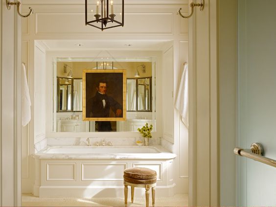 Luxury bathroom with tub and huge oil painting over it Ken Fulk