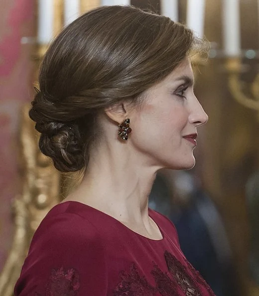 Queen Letizia attends the annual Foreign Ambassadors reception at the Royal Palace. Queen Letizia wore Felipe Varela Long sleeve dress in red diamond earrings hair