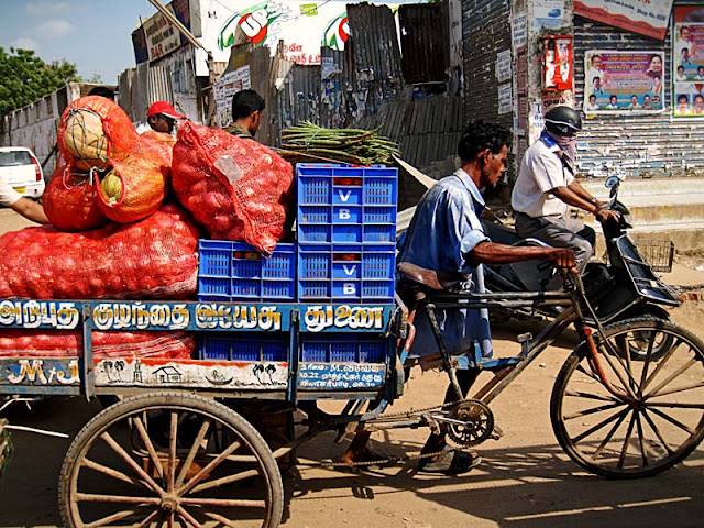 man transporting sackful of onions