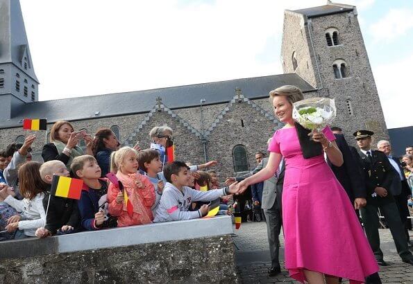 Queen Mathilde wore a pink asymmetric midi dresses by Natan.Arthur Regniers medical and pedagogical center