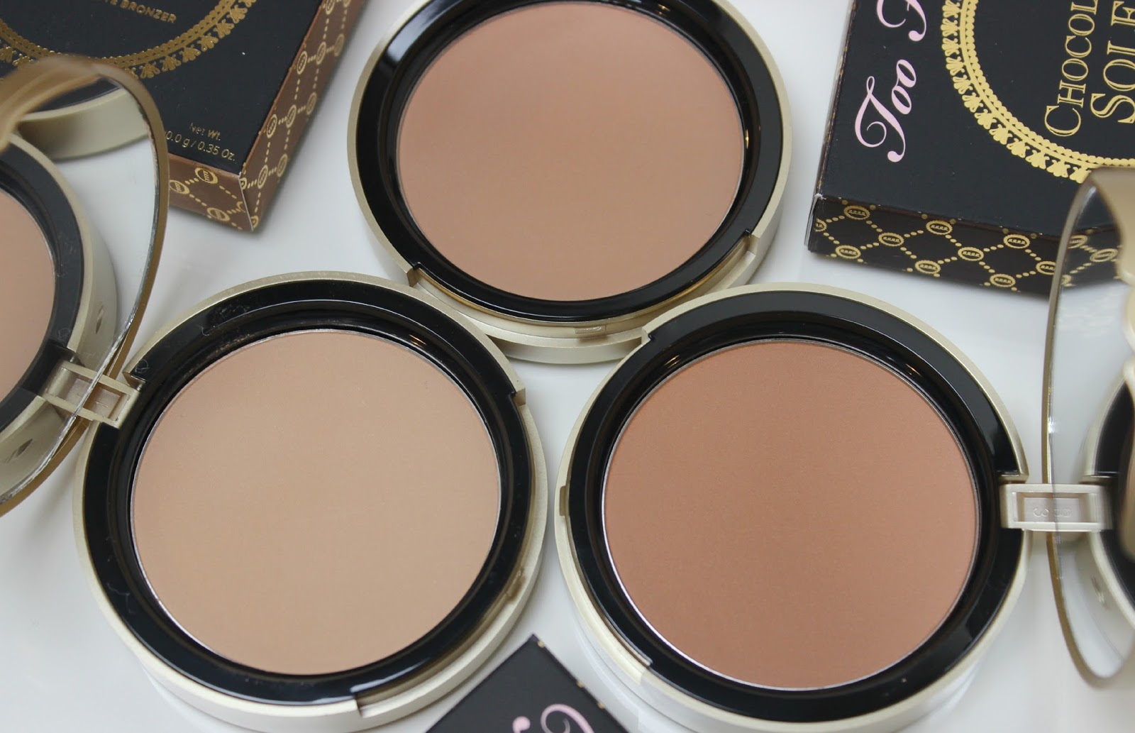 A picture of Too Faced Milk Chocolate Soleil, Chocolate Soleil and Dark Chocolate Soleil