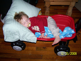 Taban asleep in wagon