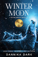 Winter Moon book cover features a pack of wolves on a snowy night, a silvery moon illuminating their gray fur as one of them howls into the night.
