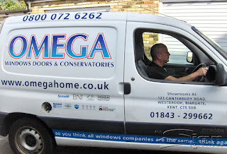 The newly branded Omega windows doors and conservatives van has the printed approval logos include Sarnafil, BNI, QMS, Fensa, Deceunick, SBD Police Preferred Specification, Maco secure, Kitemark and Home Improvement Protection. On the window the text describes the address "Showrooms At: 121 Canterbury road, Westbrook, Margate, Kent, CT9 5DB and the phone number 01843-299662.