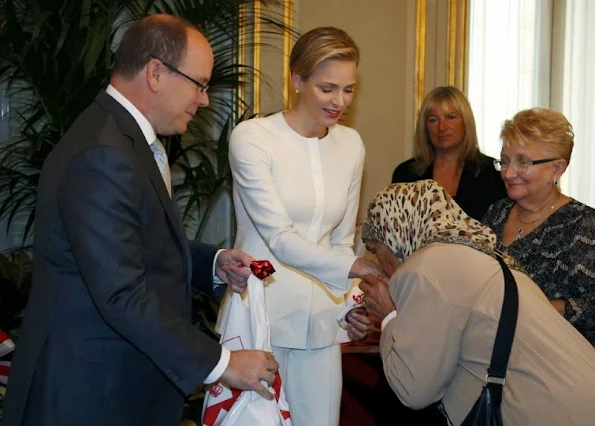 Prince Albert and Princess Charlene attended the Monaco Red Cross gifts distribution as part of the National Day ceremonies in Monte-Carlo