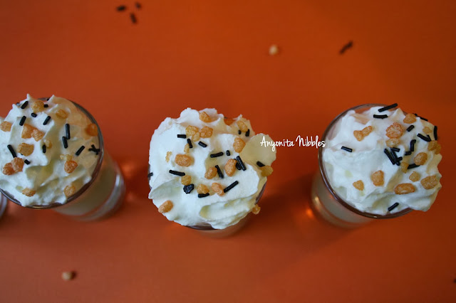 A dollop of cream and a scattering of festive sprinkles is all you need to top these vodka & white hot chocolate shooters. From www.anyonita-nibbles.com