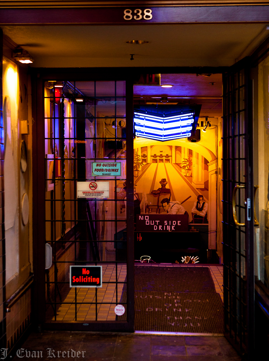 Kreider's Korner Photographs Store fronts at night on Granville Street