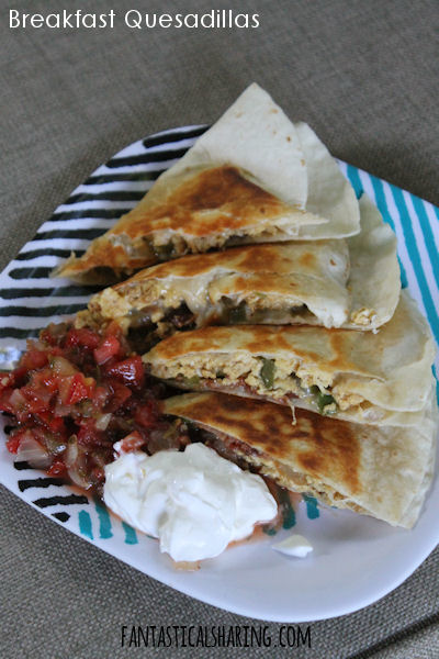 Breakfast Quesadillas // These quesadillas are packed with all the best breakfast foods and a bit of a kick with some jalapeno -- the perfect way to start the day! #recipe #breakfast #quesadillas #eggs #bacon