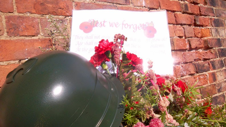 LEST WE FORGET: A floral tribute remembering the WW1 contribution made by member of the Forces from Brigg. This is the old water pump on Grammar School Road, South.