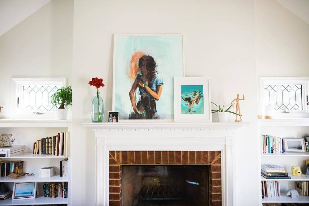 Artwork by Clare Elsaesser styled on a mantel