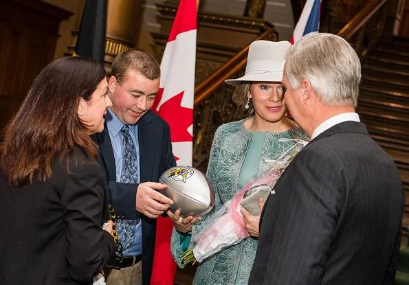 Queen Mathilde wore a gray embroidered coat by Esmeralda Ammoun, a Belgian designer