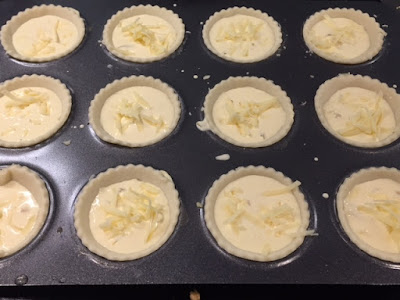  Mini Cheese and Onion Quiches mixture in the pastry cases