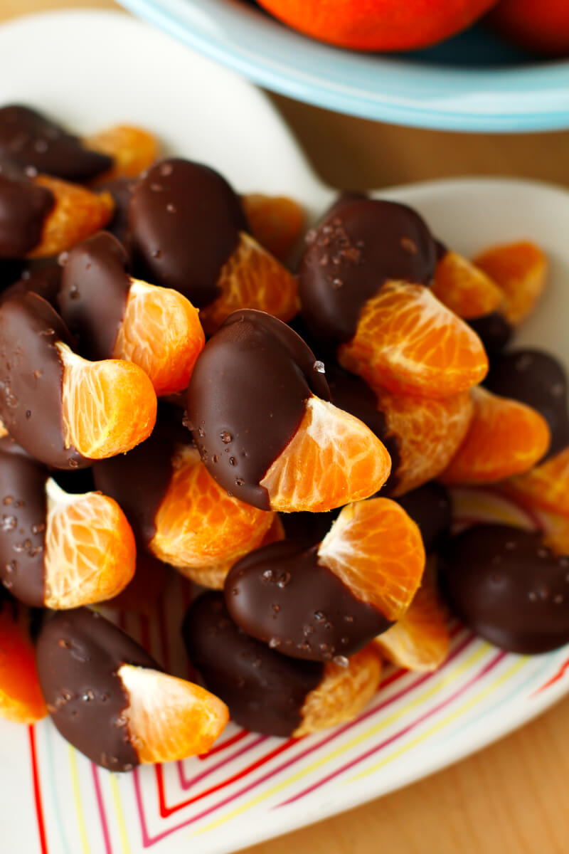 These 3-ingredient Chocolate Covered Oranges are so easy to make, you will want to eat them every day! With just a touch of sea salt sprinkled on top, they are sweet, salty, and absolutely irresistible! #chocolate #dessert #oranges #snack