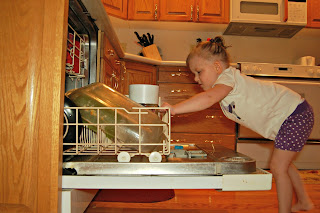 toddler helping chores dishes