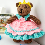 http://www.redheart.com/free-patterns/princess-bear-play-set