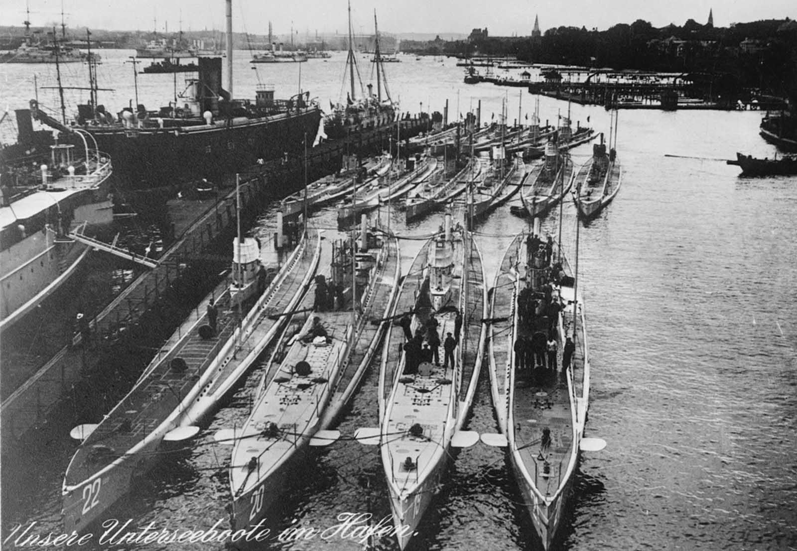 German submarines in a harbor, the caption, in German, says