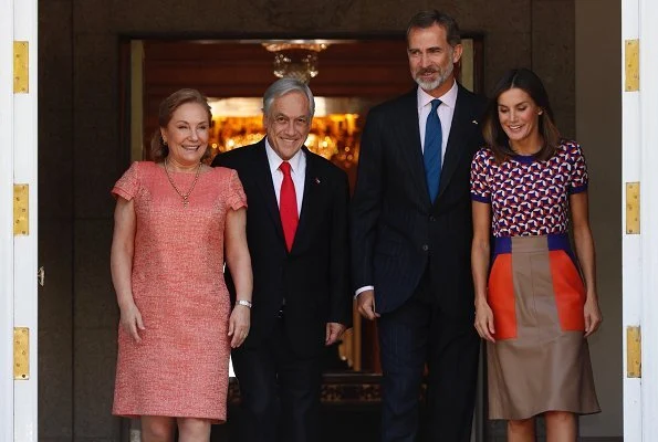 Queen Letizia wore Hugo Boss Seplea colorblock leather skirt, Boss Felisabeth Short sleeved sweater. President Sebastian Pinera and Cecilia Morel