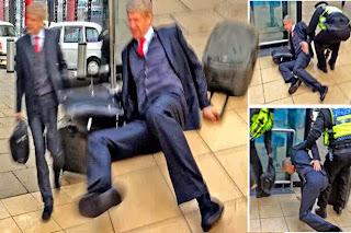 PHOTOS: Arsene Wenger Falls At Train Station After Liverpool Defeat 3