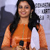 Telugu Singer Parnika Stills In Orange Top