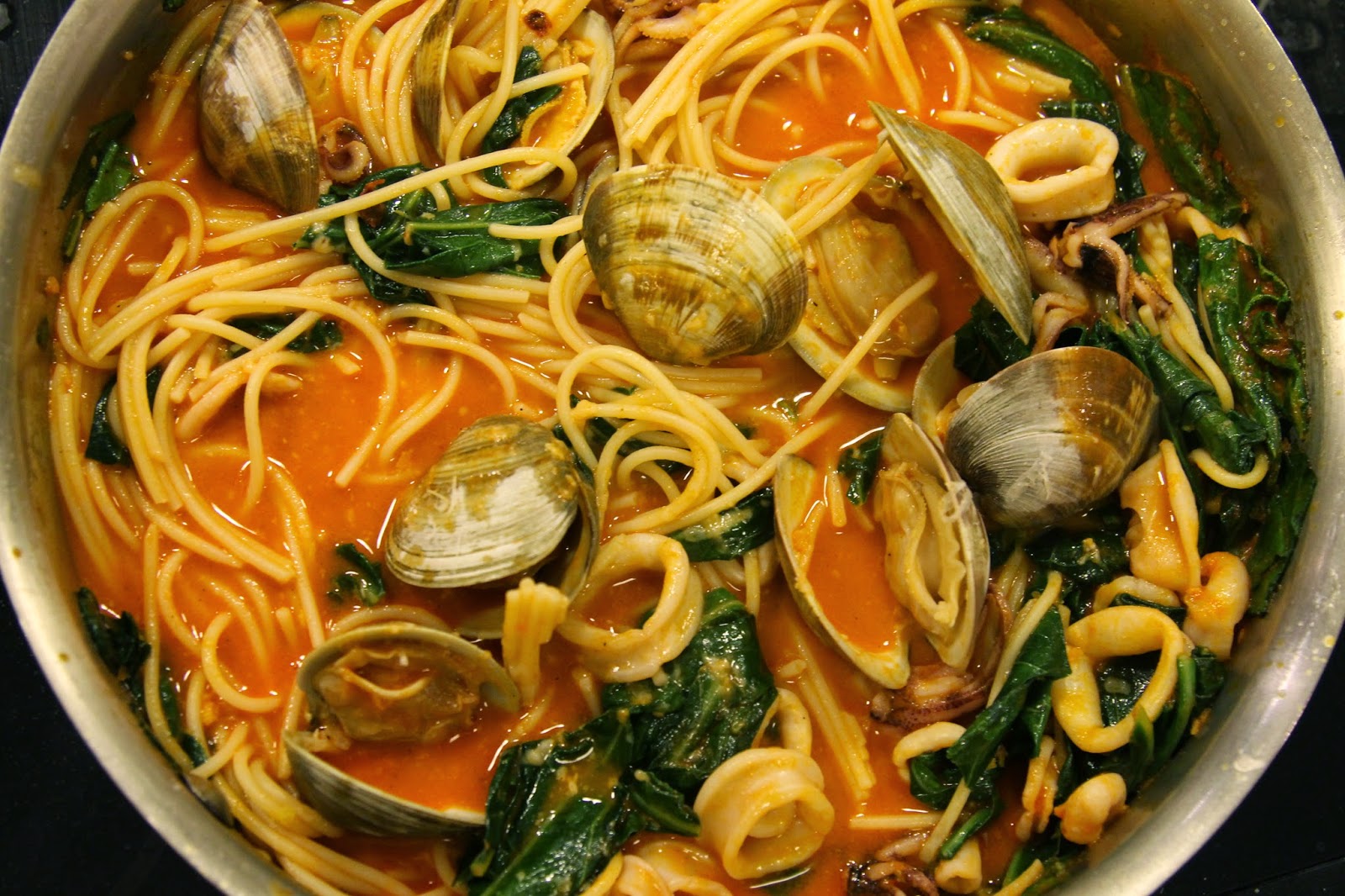 epicurean evolution Spaghetti with Clams, Squid and Braised Greens