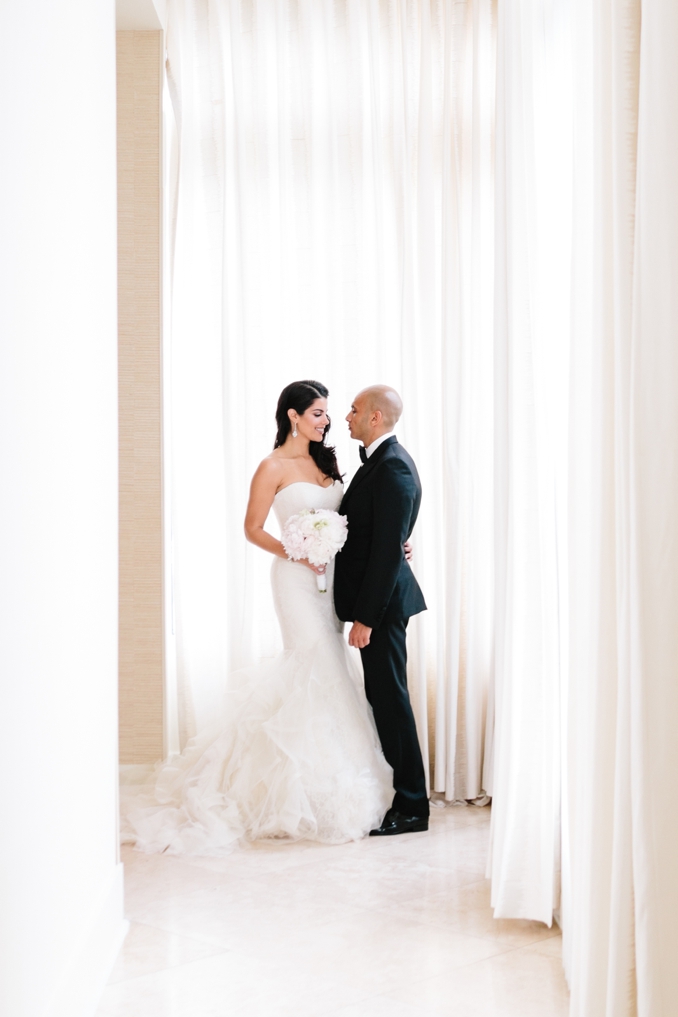 gorgeous portrait of the bride and groom in the penthouse at the raleigh hotel