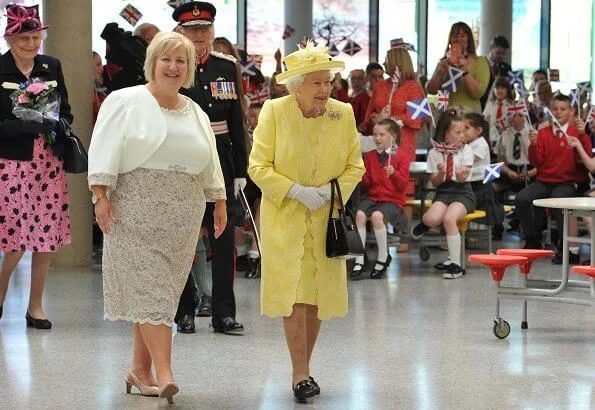 The traditional 'Ceremony of the Keys' took place tonight at Holyroodhouse in Edinburgh. yellow dress, jcoat and hat