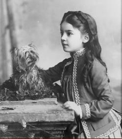 Marian Hubbard "Daisy" Bell, three-quarter length portrait, at eight years of age, standing, facing left, with dog, Gilbert H. Grosvenor Collection, Prints and Photographs Division, Library of Congress. -- http://www.alexandergrahambell.org