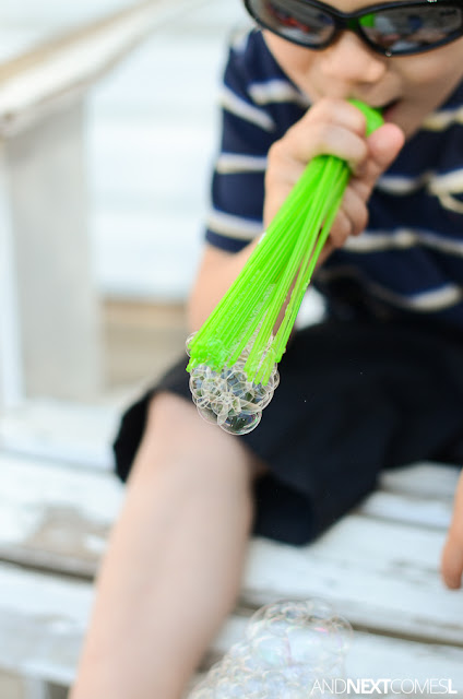 Blowing bubbles and making bubble snakes using DIY upcycled bubble blowers from And Next Comes L