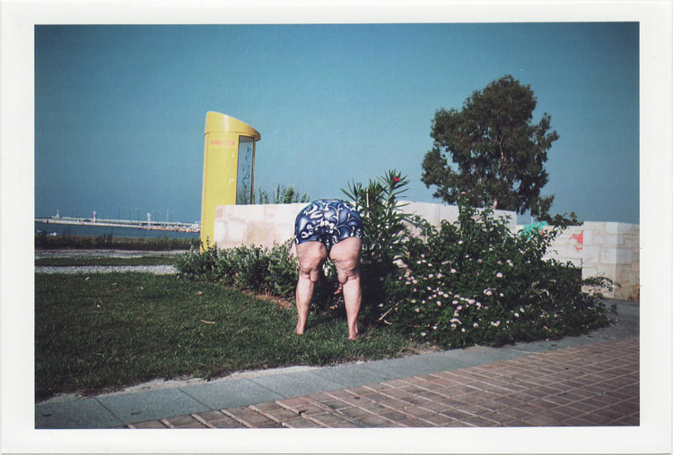 dirty photos - on the island of - photo of bending old woman with funny swimming suit near the beach