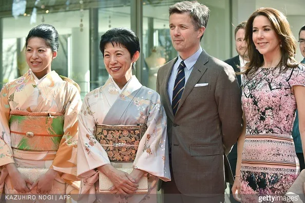 Danish Crown princess Mary and Crown Prince Frederik pose with Japanese Princess Takamado and her daughter Princess Tsuguko (L) at the official opening of the exhibition about Greenland, 'Spiritual Greenland' in Tokyo on 