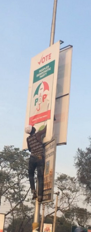 4 See what this man was caught doing to PDP posters in Kaduna