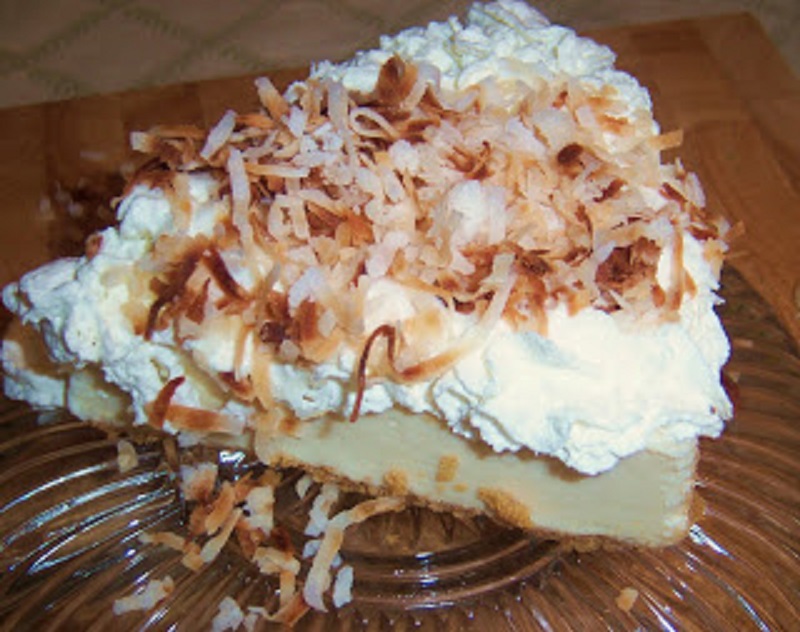 this is an all homemade from scratch coconut cream pie with whipped cream, coconut custard filling and toasted coconut
