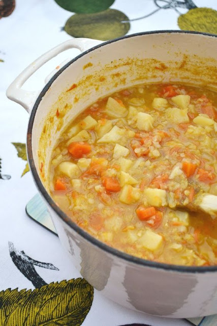 Parsnip, Carrot & Lentil Soup in a white ceramic pot 