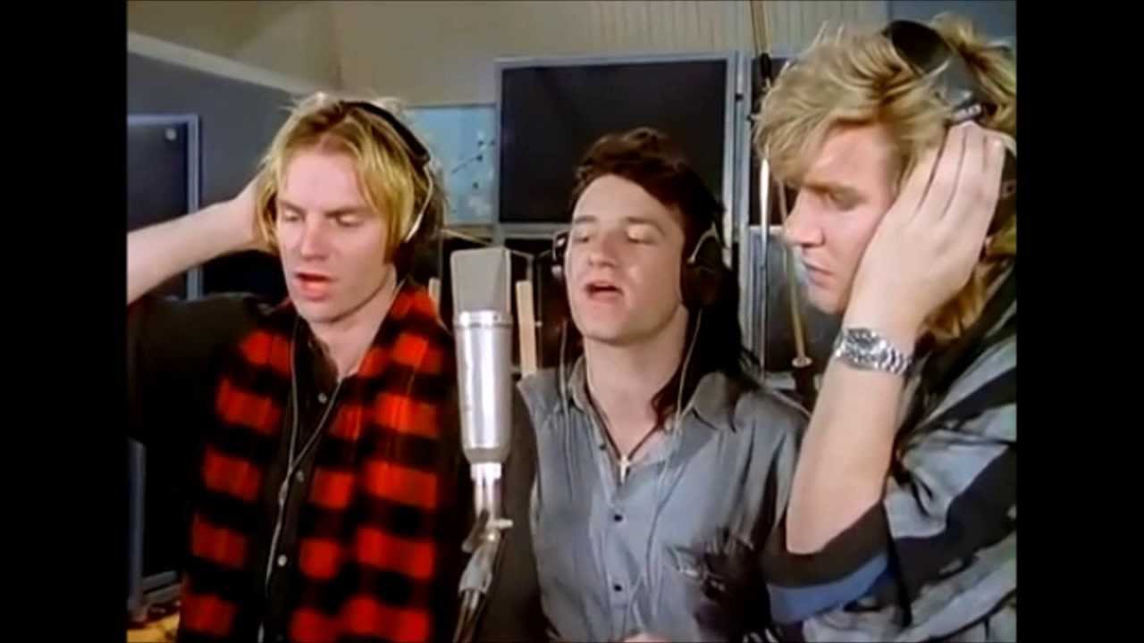 U2 Sombras e Árvores Altas Blog Bono gravando em um take sua linha em "Do They Know It’s