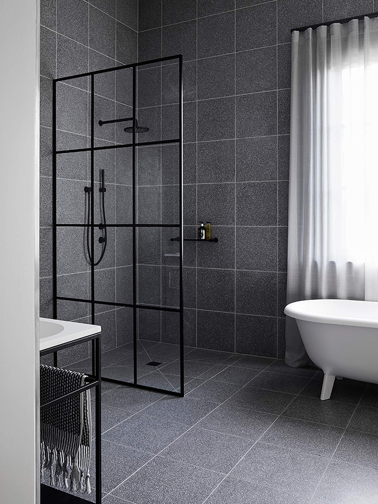 Contemporary bathroom with gray tiles designed by Studio Griffiths, styling by Studio Moore and photo by Sharyn Cairns