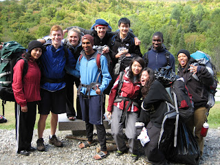 A group of people in outdoor gear, posing for a photograph.