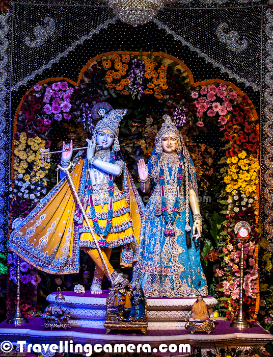 This Photo Journey is about PREM Mandir, which is quite near to ISKCON Temple in Vrindavan Town. All these photographs are shot during one of our recent trips to Vrindavan !  Let's check out ...Prem Mandir has become another source of pride for lot of Hindu devotees and tourists from all over the world. Prem Mandir is built entirely of gigantic blocks of grainless, pure white Italian marble, with no steel, bricks or cement binding between blocks.Although beautiful to the senses, perhaps its greatest value lies in its utter spiritual significance to countless supporters and devotees. It is the 'Temple of Divine Love'. Prem Mandir is inaugurated on 15 - February 17, 2012 in the presence of Jagadguru Shree Kripaluji Maharaj. It is already being called a wonder of the modern world.Lord Krishna at ground floor of Prem Mandir, Vridavan, Uttar Pradesh, India !On fifty acres of land, Prem Mandir is surrounded with magnificent gardens and beautiful fountains. On the walls of this double story monument, the true theme of our scriptures, the Vedic science of creation, the world history and the unbroken continuity of Bhartiya scriptures for over 1.9 billion years will be depicted. The beautiful deities of Radha Krishn and their leela songs are depicted in an exquisite manner. All creations on outer walls look 3 dimensional Here is a photograph of huge entry gate for Prem Mandir. Entry of Prem Mandir has lot of green patches all around. Lush green lawns look amazing and some flowers planted around the boundaries. Just after the entry gate, there is a green lawn on left side and having some trees around. On one of the tree, there is a creation which shows Lord Krishna and Radha Rani on a jhoola made up of flowers. Since no one is allowed to step over lush green lawns, I can't comment on material used in creating these ! But the quality of all these creations is unmatchable... Above photograph shows one of the artistic creation of white marble. This is a photograph of one part of pillar in Prem Mandir ! These creations were very close to natural objects and it was hard to believe that all these are created in Marble. Wonderful work done at various parts of Prem Mandir. This is one of the magical part of Prem Mandir in Vrindavan. To us this seemed like a tourist place as compared to a typical temple, but we were proved wrong when we entered into the core of Prem Mandir (Temple).Architecture of Prem Mandir is based on the book 'Shilp-Ratnakar', written by Vishwa Karma. It is apparently the first temple in the world where the many pastimes written in Bhagwatam  are illustrated on the wall. The inside view of the temple is said to overwhelm visitors with religious feelings. Huge Deities of Radha Krishna are situated in the center of ground floor. The inside walls are beautified with engraved paintings of Radha Krishn and glimpses of group kirtan (chanting) and lectures of Jagadguru Shree Kripaluji Maharaj. It is said that the beauty and art of the tomb-type roof cannot be described in words. The first floor is glorified with the Deities of Sita Ram. Towards the south side of this floor the scenes of the pastimes of Lord Chaitanya Mahaprabhu are engraved with multi color stones and towards the north side the pictures of all the 4 previous Jagadgurus and great rasik saints like Jeev Goswami, Haridas Ji, Hit Harivansh Ji and Vallabhacharya Ji are engraved beautifully. Besides that the beutiful verses are inscribed on the walls.My photographs don't do any justice to lighting of Prem Mandir ! Huge light chandeliers were used to lit various parts of the temple. Upper storey of Prem Temple is dedicated to Ram Mandir ! Above photograph shows one of the smallest lighting stuff, which was hanging around various walls of Prem Mandir !  This photograph shows a close-up of Lord Krishna while he has picked up Govardhan Parvat on his finger. There is a huge creation in front of Prem Mandir which shows Lord Krishna lifting up the Govardhan Parvat and lot of other folks with cattle under it. Here is a photograph showing some of the creations carved on inner walls of the temple (Prem Mandir). Check out following link for more details about Prem Mandir - http://knol.google.com/k/david-mccaldin/prem-mandir-the-inauguration-of-a/2pr18mcjtayt9/19#