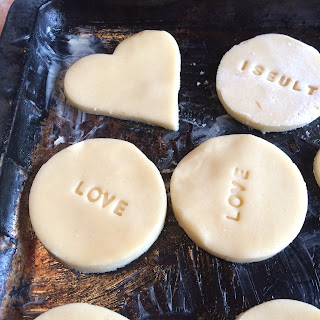 Stamped shortbread biscuits ready for oven