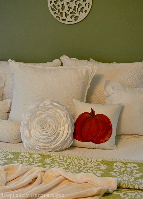 Hand Painted Pumpkin Pillow Cover on a bed