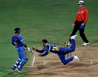 Tillakaratne Dilshan leaps to his right to dismiss Virat Kohli caught-and-bowled, World Cup 2011, Mumbai, April 2, 2011