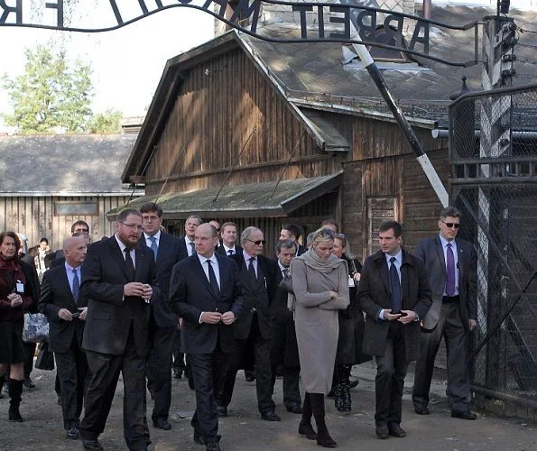 Prince Albert and Princess Charlene have visited the memorial of the former Nazi German death camp of Auschwitz-Birkenau and laid flowers at its Execution Wall