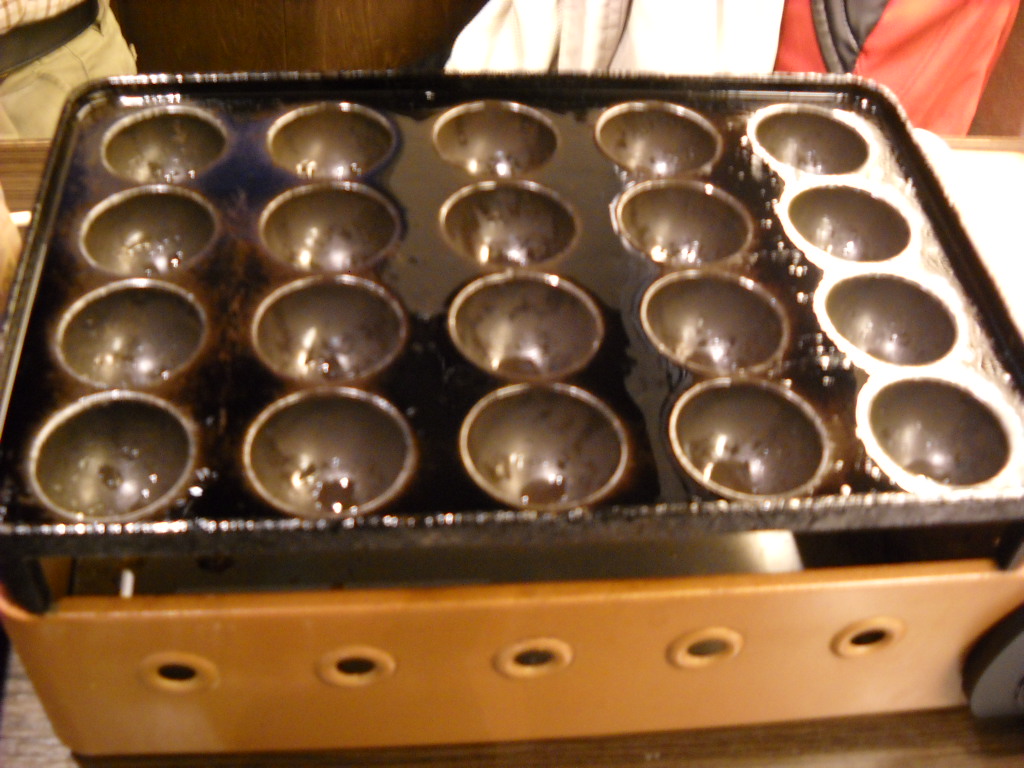 Daily Glimpses of Japan Cooking Takoyaki In Osaka