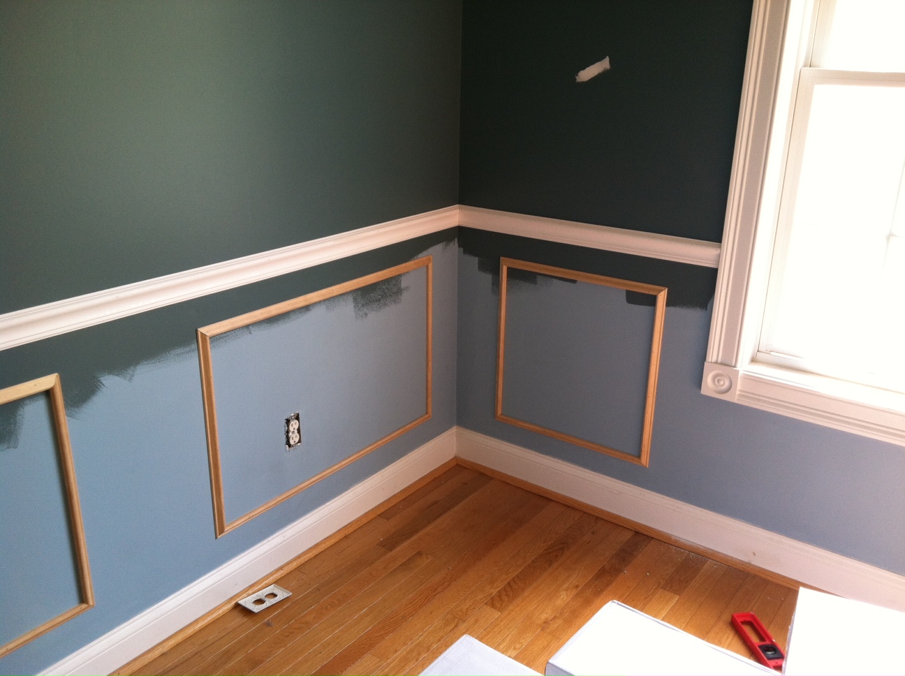 ...of expensive recessed wainscoting with simple panel molding cut and appl...