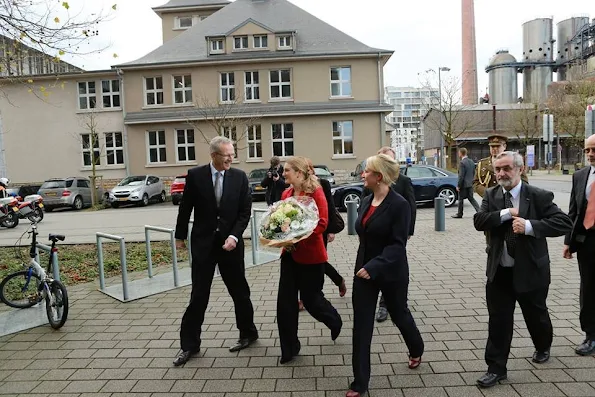 Grand Duchess Stephanie visited Belval Campus in Luxembourg University. Princess Stephanie style Prada clutch bag, wore Prada red jacket