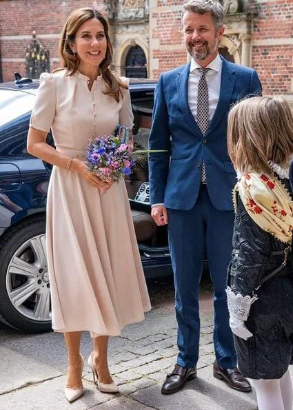 Crown Princess Mary wore a new puff-sleeve belted wool dress by Beulah London. Beulah Ahana midi dress. Queen Margrethe and Crown Prince Frederik