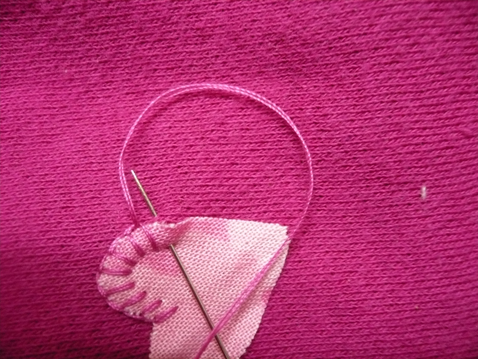 Hand sew along the edge. The stitch I have used makes sure that the edges are covered so they