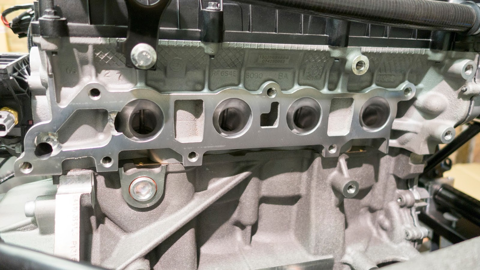 Exhaust manifold ports with gasket and covering tape removed.